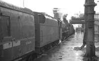 An unidentified double-headed train stands alongside platform 1 at Carlisle on a wet 30 July 1966. The locomotives are Black 5s 44833 and 45107.<br><br>[K A Gray 30/07/1966]