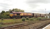 EWS 66080 passing Didcot northbound on the Oxford line on 25 September with an empty car train.<br><br>[Peter Todd 25/09/2014]