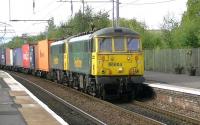 Train 4M11 Coatbridge to Daventry intermodal passing through Coatbridge Central on 4 September 2014 double headed by Freightliner locomotives 86604 + 86607.<br><br>[Ken Browne 04/09/2014]
