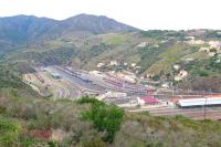Cerbere is the last station on the French rail network before crossing the border into Spain and hosts a large complex of carriage and freight sidings to serve both standard, Spanish (1676mm) and mixed gauges.  The station is shown at the bottom right of the photograph and twin bore tunnels 1064m in length cross the border into Spain at Portbou allowing trans-border traffic of both gauges to be carried.<br><br>[Malcolm Chattwood 23/09/2014]