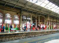 Platform scene in red and green. Preston station, 24 September 2014.<br><br>[Veronica Clibbery 24/09/2014]