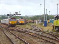 View over Westbury Yard during the late morning of 29 August 2014. Present from left to right are a DB class 66 on a rake of lifting roof car carrier wagons, GBRF 66752 <I>The Hoosier State</I> with an infrastructure train, a DB class 08 shunter, a Freightliner class 66, and Colas Railfreight 70809. <br><br>[David Pesterfield 29/08/2014]