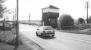 A vehicle heading east towards Sunderland about to pass over the out-of-use level crossing at Usworth, County Durham in 1992. Located on the Leamside line between Pelaw Junction and Washington, the station (which stood off to the right) closed to passengers in 1963. [Ref query 9490]<br><br>[John Furnevel 07/05/1992]