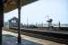 The signal cabin name still carries the name <I>Dovercourt Bay</I> (the <I>Bay</I> had been dropped 4 years earlier) at Dovercourt station on 15th August 1976. The view is across the bay towards Parkeston Quay. The opposite down platform became redundant in 1968 when all passenger traffic between Parkeston Quay and Harwich Town was transferred to the up line. The down platform and signal cabin were removed in the 1980s during electrification.<br><br>[Mark Dufton 15/08/1976]