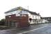 Bedlington South box on 24 September 2014, with <I>The Railway</I> pub standing just beyond the level crossing. Bedlington Station is on the north side of the crossing just off picture to the right. [See image 22454]<br><br>[John Steven 24/09/2014]