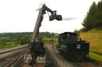 Baldwin no 2 being coaled by hydraulic grab outside Pant on the Brecon Mountain Railway. [See image 48358]<br><br>[Ken Strachan 24/08/2014]