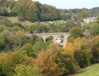 Never looks quite the same twice. The valley of the North Esk and a small section of Lasswade Viaduct. The 1867 viaduct, designed by Thomas Bouch, once carried the Polton branch, which closed to passengers in 1951 and to all traffic in 1964. Photographed mid morning on 9 October 2014 looking north, with Autumn starting to make its mark on the landscape. <br><br>[John Furnevel 09/10/2014]
