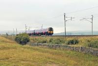 Part way down the long descent of Shap Bank, TPE 350410 passes Scout Green on 19 September with a service from Scotland to Manchester Airport. <br><br>[Mark Bartlett 19/09/2014]