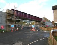Work continuing on the new railway bridge taking the Borders Railway over Currie Road, Galashiels, on 24 October 2014. View north west towards Galashiels station.<br><br>[John Furnevel 24/10/2014]