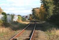 DMU 158834, destined for Birmingham International, passes the former goods yard at Criccieth on 14 October and descends towards the level crossing near the Esplanade.<br><br>[Colin McDonald 14/10/2014]
