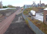 Looking north to the former Lady Victoria Colliery (now the Scottish Mining Museum) on 27 October, with Newtongrange station in the background.  The tanker lorry is parked on what was the NCB loco shed yard, with the shed itself surviving on the right in industrial use.<br><br>[Bill Roberton 27/10/2014]