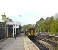 156426 is ready to leave Buxton with the 09:22 to Manchester Piccadilly and is allowed an extra 5 minutes for the journey in the leaf fall season.  The restored fanlight window which was the gable end of the original station is visible above the train [see image 31175].  Both platforms are in daily use whilst the centre road is used for the overnight stabling of Class 150 and 156 units in regular use on the line.<br><br>[Malcolm Chattwood 31/10/2014]