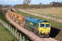 View north at Arniston towards Newtongrange on 3 November with 66610 on the rear of a returning ballast train.<br><br>[Bill Roberton 03/11/2014]
