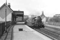 A Helensburgh - Bridgeton Central train arrives at Dalreoch on 20 April 1957 behind V1 67648. Note the Dennystown Forge to the right (north) of the station.<br><br>[G H Robin collection by courtesy of the Mitchell Library, Glasgow 20/04/1967]