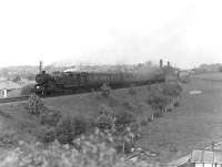 A train for Neilston High has just cleared the bridge carrying the East Kilbride line approaching Williamwood on 21 May 1960. Locomotive in charge is Fairburn 2-6-4 tank 42127. <br><br>[G H Robin collection by courtesy of the Mitchell Library, Glasgow 21/05/1960]