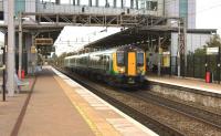A London Midland Class 350 emu departs from Liverpool South Parkway on 4 November 2014 with the 1534 Liverpool Lime Street - Birmingham New Street. The modern 6 platform station in the Garston district of Liverpool opened in 2006.<br><br>[John McIntyre 04/11/2014]
