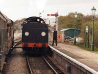 The signalman at Harmans Cross station on the Swanage Railway exchanges the single line tokens with the crew of a Swanage bound train on 19 October 2014.<br><br>[John McIntyre 19/10/2014]