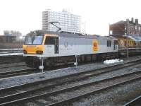 Standing at the south end of Crewe station on 9 January 2014 is DB 92036 <I>Bertolt Brecht</I> with a short rake of refurbished rolling stock destined for Bescot yard following repair at Crewe EMD. <br><br>[David Pesterfield 09/01/2014]