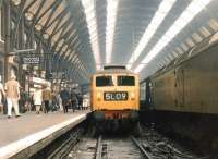One of the Finsbury Park batch of Brush Type 4s, no 1775, stands alongside a classmate at the buffer stops at Kings Cross station in June 1969 after bringing in ecs from Holloway carriage sidings.<br><br>[John Furnevel 06/06/1969]
