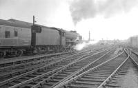Rebuilt Jubilee 4-6-0 no 45735 <I>Comet</I> leaves Carlisle on 3 August 1963 with the 1X77 relief Perth - Euston. The locomotive was one of two examples of the class to undergo such rebuilds [see image 29782].<br><br>[K A Gray 03/08/1963]