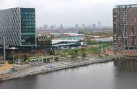 The Metrolink tram terminus at Media City UK, as seen from the Air Shard viewing platform at the Imperial War Museum on 16 November. A tram is arriving off the Eccles line, the triangular junction with which is just behind the large building on the right of this picture. <br><br>[Mark Bartlett 16/11/2014]
