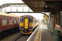 Platform scene at Chappel and Wakes Colne on 16 November showing Greater Anglia unit 153322 calling with the 10.26 Sudbury - Marks Tey service. <br><br>[Peter Todd 16/11/2014]