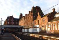 The empty Station Hotel basks in the early morning sunlight overlooking Ayr station on 10 November 2014. Unfortunately this shows up the sad state of the building. At least the pigeons don't seem to have found a way in yet.<br><br>[Colin Miller 10/11/2014]