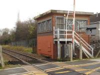 The disused signal box, on the south side of the line, located beyond the Station Road level crossing at the east end of Dodworth Station as seen in November 2014. It replaced the original MS&LR box, which was demolished as a result of a derailment in January 1955.<br><br>[David Pesterfield 19/11/2014]