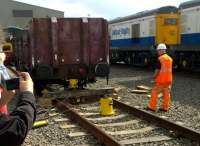 The process to get derailed wagons back on the road usually takes place far from public scrutiny; but this was an Open Day at Etches Park in September 2014. In case you missed it, they use a bottle jack as shown to lift the wagon up; then a hydraulic ram to move it sideways. Notice the Peak on the left, and the class 20's on the right.<br><br>[Ken Strachan 13/09/2014]