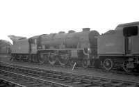 Locomotives stabled in the shed yard at Carlisle Kingmoor on 18 July 1964 include Royal Scot 46132 <I>The King's Regiment Liverpool</I> buffered up to the rear of Fowler 2-6-4 tank 42353, both 12A residents.<br><br>[K A Gray 18/07/1964]