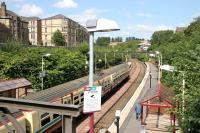 A Springburn train leaving Alexandra Parade in August 2006, less than a mile and a half from its ultimate destination. View north from the A8 road bridge.<br><br>[John Furnevel 11/08/2006]