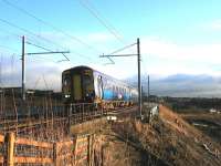 Just after crossing the Cutty Sark bridge on 12 December, 156503 passes the spot where the M8 extension will pass under the Whifflet line. The 156s will be displaced by electric trains on this route within days. <br><br>[Colin McDonald 12/12/2014]