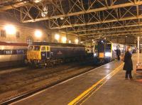 A busy scene at Carlisle station on the afternoon of 15 December 2014. A train for Manchester Airport is at platform 4, a northbound Pendolino at platform 1 and 47815 Great Western on the centre road. <br><br>[Bruce McCartney 15/12/2014]