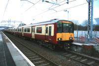 Class 318 EMUs 255 and 256 form the 1514 service to Motherwell at Mount Vernon on the 14th December 2014, the first day of the new timetable using electric rather than diesel multiple units.<br><br>[Colin McDonald 14/12/2014]