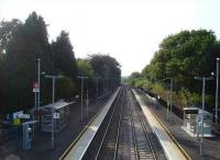 View looking west from the new footbridge along the expanded Gowerton Station in July 2013, with the re-laid up line and rebuilt platform on the right, following re-doubling of the line from near Llanelli to east of Gowerton station. [Ref query 6792]<br><br>[David Pesterfield 15/07/2013]