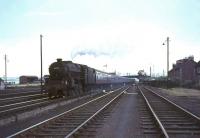 Black 5 44790 approaching Carstairs station from the south on 17 July 1965 with a summer Saturday train from Morecambe. Strawfrank Junction signal box stands in the right background.<br><br>[John Robin 17/07/1965]