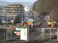 A quiet Galashiels seen from Station Brae during the morning of Boxing Day 2014, with the BAM works compound secured for the holiday. The partially constructed transport interchange and railway station face one other across the A7 Ladhope Vale, which has recently reopened for 2-way traffic.  <br><br>[John Furnevel 26/12/2014]