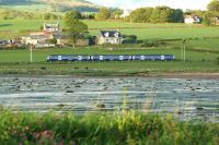 An eastbound Class 334 emu approaching Ardmore East level crossing on the evening of 1 June 2013. Photographed from Ardmore Point looking across to Lyleston Farm.<br><br>[John McIntyre 01/06/2013]