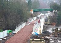 Looking south towards Galashiels station on 26 December 2014 over Wheatlands Road and the Gala Water. The new Plumtreehall Brae footbridge (not yet opened) spans the trackbed in the background. This will replace the road bridge that provided a link between the A7 and the A72. [See image 49908]<br><br>[Ewan Crawford 26/12/2014]