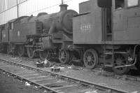 Locomotives awaiting the cutter's torch at Doncaster Works in October 1962 include Fairburn 2-6-4T no 42255 and Stanier 2-6-4T no 42527. The latter is one of the original Tilbury tanks, withdrawn from Shoeburyness shed in June of that year following electrification of the route and cut up here a month after the photograph was taken. <br><br>[K A Gray 07/10/1962]