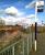 Mud, mud, glorious mud: a new railway station starts to take shape at last between Coventry's Ricoh Arena (left) and the popular Arena Retail Park (right). The steps lead down to a pedestrian underpass running below a three arch railway viaduct. View north towards Nuneaton on 19 October 2014. [See image 40050]<br><br>[Ken Strachan 19/10/2014]