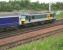 Early one morning. EWS 90022 <I>'Freight Connection'</I> stands well beyond the down platform at Carstairs at 0620 on 11 July 2006, having just brought in the 15 coach Caledonian Sleeper from Euston. Back in the station the train is being divided between coaches 8 and 9, following which 90022 will continue to Glasgow Central and the rear portion will head for Edinburgh Waverley behind EWS 37405 [see image 9871].     <br><br>[John Furnevel 11/07/2006]