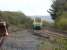 Arriva 175102 leans into the curve after passing Kidwelly level crossing heading east towards Swansea with the 13.01 service from Carmarthan to Manchester Piccadilly in October 2012. The overgrown and rusting Gwendraeth Valley line exchange sidings are on the left, with part of the head shunt stop block just visible.<br><br>[David Pesterfield 31/10/2012]