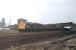 A tidy looking 40011, formerly named <I>Mauretania</I>, heads east out of Healey Mills Yard with coal hoppers in April 1979. The train is passing through the site of Horbury and Ossett station. D211 was the second of the production (as opposed to pilot scheme) English Electric Type 4s and lasted in service another 18 months before withdrawal and scrapping.<br><br>[Mark Bartlett 10/04/1979]