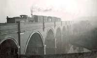 On a misty November morning in 1948, Caley <I>Jumbo</I> 57307 of Hamilton (West) shed takes a freight over Waulkmill Glen Viaduct between Patterton and the former Lyoncross Junction.  