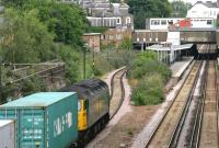 Freightliner 57001 with an eastbound container train approaching Highbury and Islington NLL station in July 2005. Note the mix of overhead and third rail electrification systems in use at this time. <br><br>[John Furnevel 22/07/2005]
