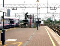 Looking south west from the GE main line platforms at Stratford in 2005 with a commuter service leaving for Liverpool Street. On the right is Stratford Central Junction, which gives access to the North London Line [see image 49138].<br><br>[John Furnevel 22/07/2005]