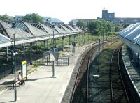 The view south from the footbridge at Tynemouth in the summer of 2004, showing the sad state of the station's former excursion bays and canopies at that time.<br><br>[John Furnevel 10/07/2004]