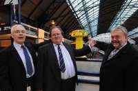Bob Gardiner, Peter Ovenstone and John Yellowlees with the original E&G milepost 14, now on permanent display at Queen Street station, Glasgow (See News Item).<br><br>[Chris Dixon 26/11/2008]