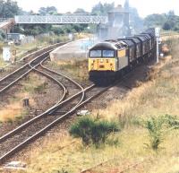 56046 passing Eaglescliffe in August 1997 with a freight off the Northallerton line bound for industrial Teesside. The train has just cleared Eaglescliffe South Junction with the Darlington route diverging west beyond the rear of the train.<br><br>[John Furnevel 07/08/1997]